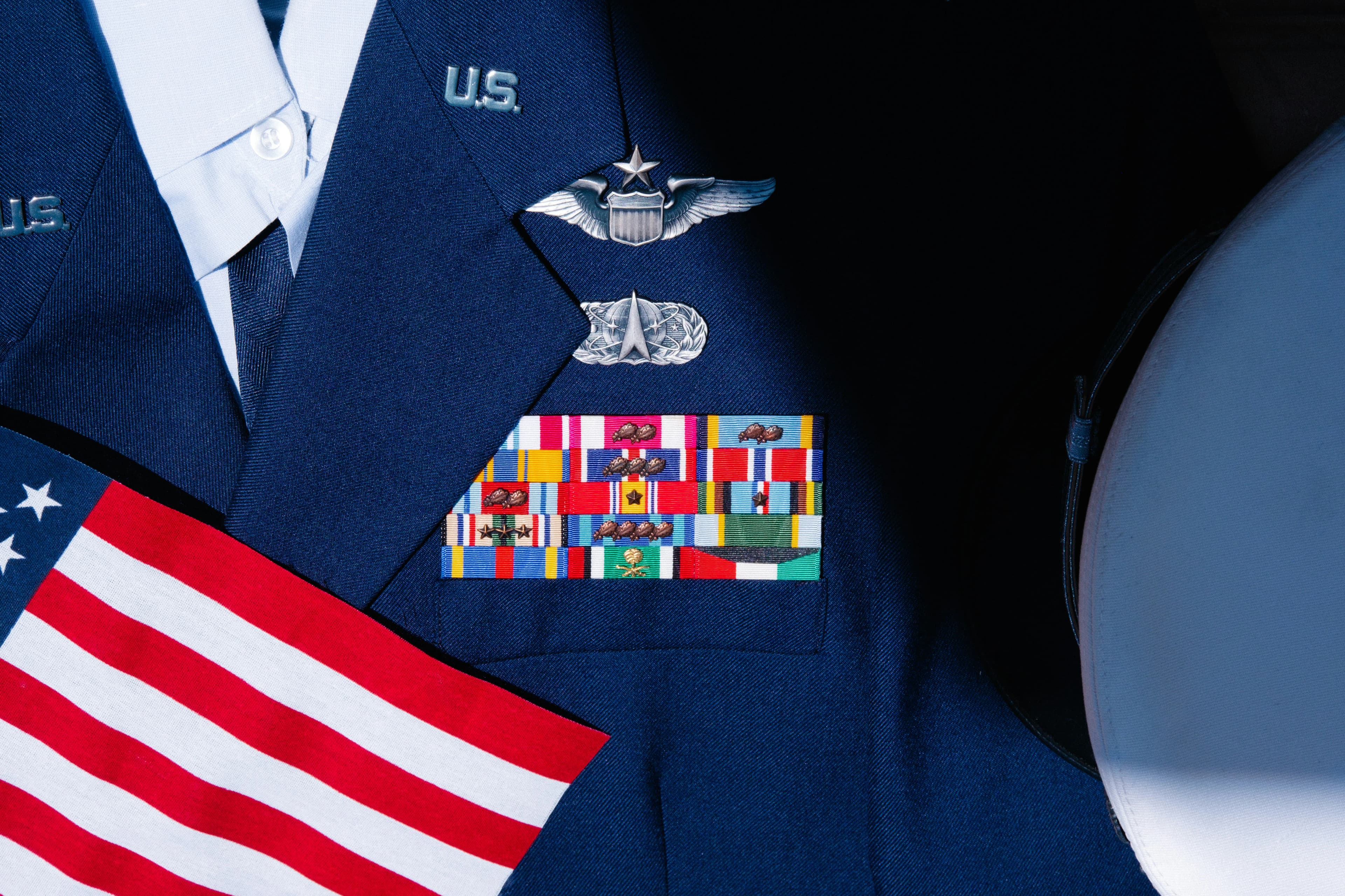 U.S. Air Force uniform with ribbons, awards, and badges.